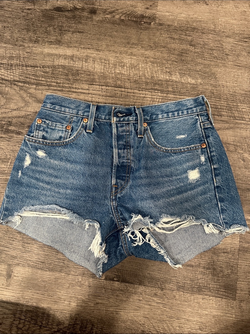 Levi's Distressed Denim Cutoff Shorts in Medium Blue